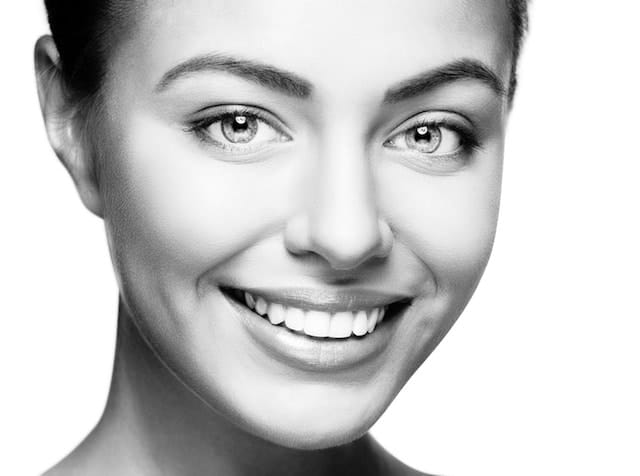 Woman with a bright, healthy smile — a TruCare Dentistry patient